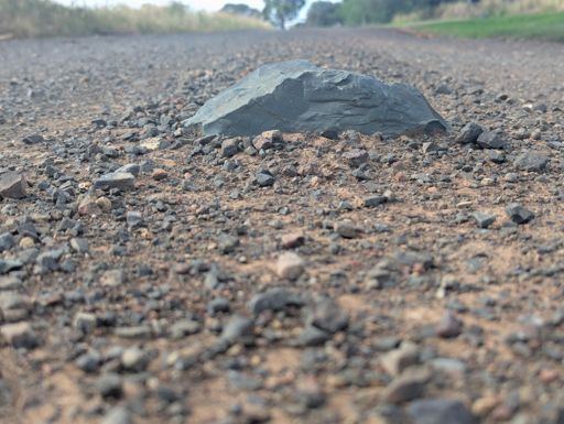 This is the sort of embedded rock on MonterayRd that you don't want to hit on a bike, or even in a car- it might rip the sump out of an ICE vehicle.
