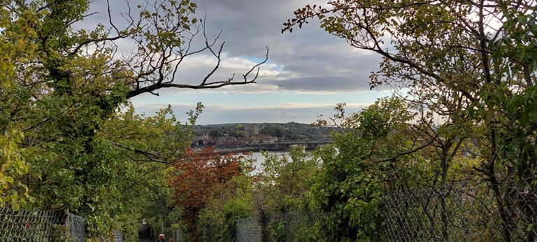 View over to Rochester Castle from the Route 1 path between Frindsbury's Parsonage Lane down to Commissioner's Road, close to River Medway. With Rochester Bridge's railway bridge (one of four RB bridges) crossing the River Medway at this point. https://en.wikipedia.org/wiki/Rochester_Bridge