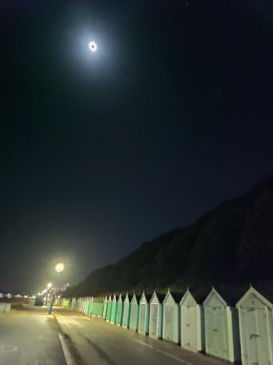 Bournemouth seafront .
Curiously the moon has a black spot in the photo - this looks like a camera/processing error, it really is wasn't like that on the night!