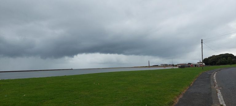 I took this photo for the dramatic "will it, won't it" cloud over the mouth of the River Tweed.  The John Rennie the Elder-designed  half mile (880m) pier was built between 1808 and 1825, and the Joseph Nelson lighthouse in 1826.  The chimney is the sole survivor from Spittal Chemical and Fertiliser Works, run by Fison.  The spire belongs to Berwick United Reformed Church in Spittal, which we cycled past. It opened in 1878 and closed in Dec 2020.  After this, we climbed, passing Elm Bank Coastal (caravan) Park, away from the coast till Bamburgh.at Mile 24.  https://historicengland.org.uk/listing/the-list/list-entry/1041698?section=official-list-entry & https://www.geograph.org.uk/photo/6611976 & http://spittalisgreat.co.uk/wp-content/uploads/2020/11/November-2020.pdf
