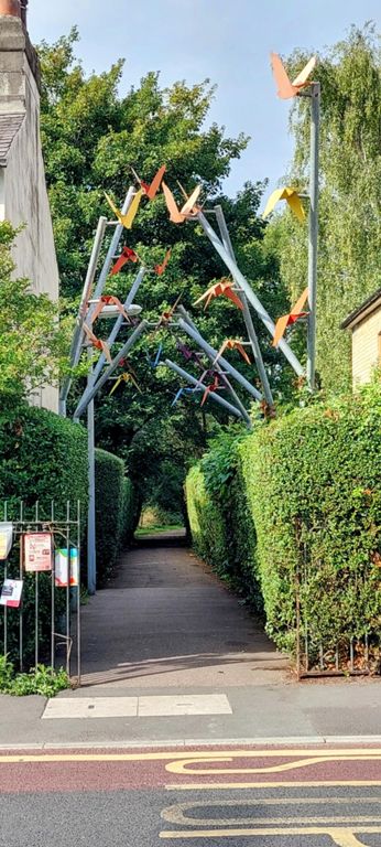 Flocking Birds, a 2015 public art commission,  by Dallas Pierce Quintero over the entrance to Histon Road Recreation Ground.  https://www.cambridge.gov.uk/flocking-birds-sculpture & http://www.d-p-q.uk/projects/flocking-birds/
