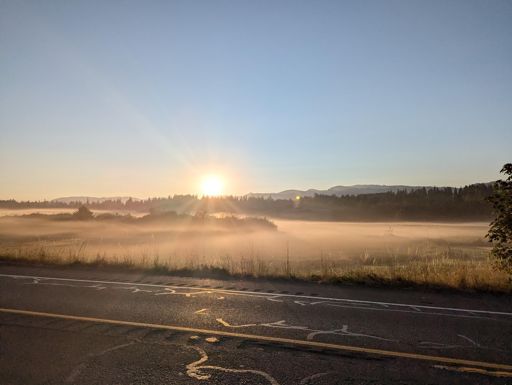 Sunrise over some low fog on day 1. James is about to get a flat tire.