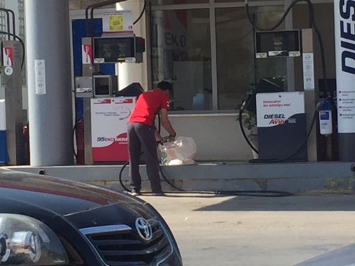 Yep, he’s filling a bag with petrol