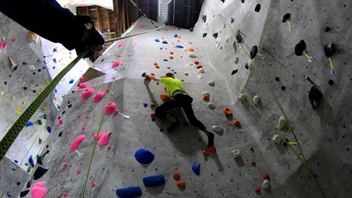 Climb 4 - Orange 5.10b (F): This new route in The Alcove is one of the two new 5.10b's recently set here.  Frank thought this route was easier than the adjacent White 5.10b that I planned to climb as my last for today.

The starting moves felt cramped, but up higher the route opened up, some moves requiring a long reach and some careful balancing.  The route traverses up and to the right, then back left through the middle wall before traversing right again before the top.

Most of the holds were comfortable rounded wedges that looked from below like boobs with a grooved and recessed side that telegraphed how to position one's body to best make use of the hold.

At each move there seemed to be a reasonable way to continue.  But, as I kept moving the chalk on my hands started to wear off or become damp.  I could feel my fingers slipping on these wedges.  These wedges weren't as secure as they looked fingers that were losing their grip.  As I neared the top I worried that a hand might slip off, but they retained their grip.  I was happy to reach the top.

I found this route as difficult as the prior Black   I was surprised when Frank told me that it had originally been graded 