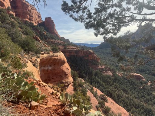 Trail wraps around the fin on this flatter band between the cliffs