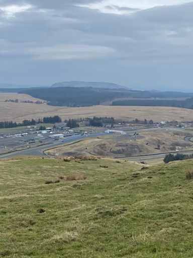 The racing circuit with possibly Loch Glow making an appearance distant left.