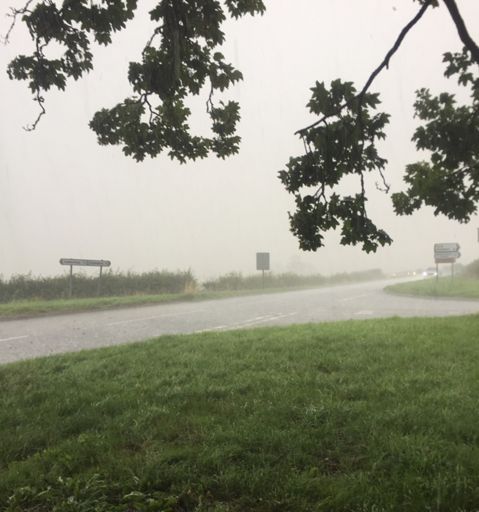 Taking cover as best I can from the hailstorm. Thunder, lightning and flooded roads to boot!