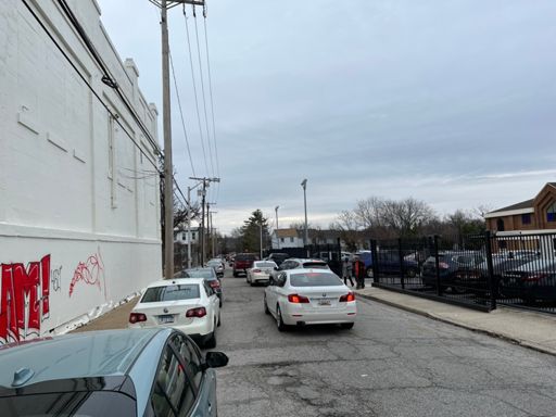 Streets really backed up as people exit from (presumably) a neighborhood church. We cut way to the front of the line on our bikes!
