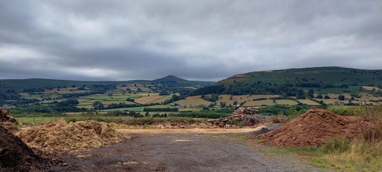 To our left/west. Th one to the right has text cut in it.