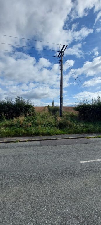 Thomson's Monument on the right of the B6461. I stopped and spoke with a gentleman sitting reading a newspaper by a house in the Sydenham House driveway. He told me what it was. https://www.scottish-places.info/features/featurefirst18606.html