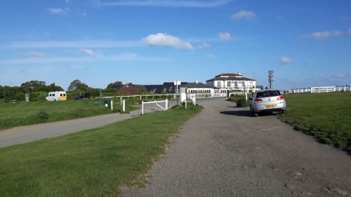 Keep aiming for the pub, then take the hard (150degrees) left by going atound the pictured gate