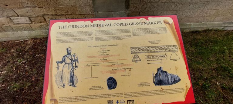 Took this photo to read the contents later.  

This webpage is about the Grindon (parish) Medieval Coped Grave Cover: http://www.thorpe-thewles.org.uk/Grindon%20Medieval%20Coped%20Grave%20Cover.htm