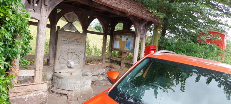 I thought this was a unique bus shelter. It is a memorial fountain:   https://commons.wikimedia.org/wiki/File:Memorial_fountain_and_post_box_at_Bettws_Newydd_-_geograph.org.uk_-_780339.jpg   in Betts's Newydd: https://en.wikipedia.org/wiki/Bettws_Newydd