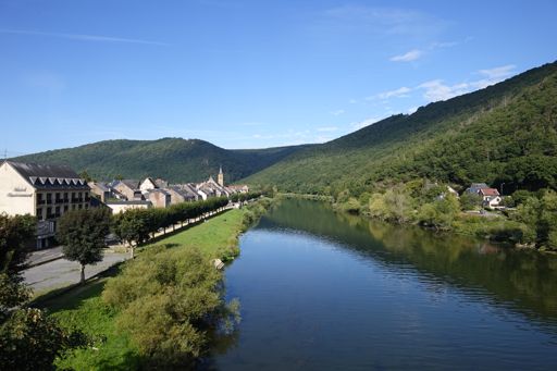Revin in the morning sunshine. The parapente launch site is the gap in the tree line on the brow of the hill upper right.