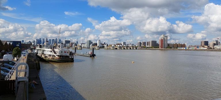 @13.22. MV Royal Iris - former ferry, launched 1950, operated 1951-1991, laid up here since 2002. & Thames Barrier. Docklands business area in background.  https://en.wikipedia.org/wiki/MV_Royal_Iris