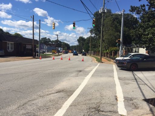 This wreck is on Old Buncombe Road right in front of Velo Valets. There is a vehicle on its side with its nose on a telephone pole