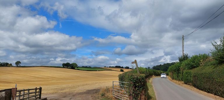 One side of the road by a farm 