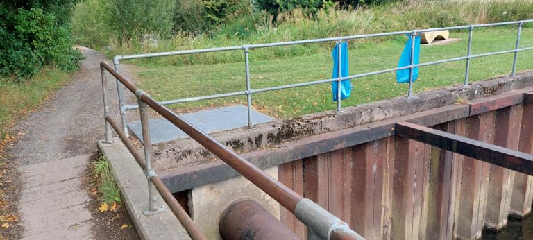 Tarmac became compacted gravel. The structure is over Newton Brook.