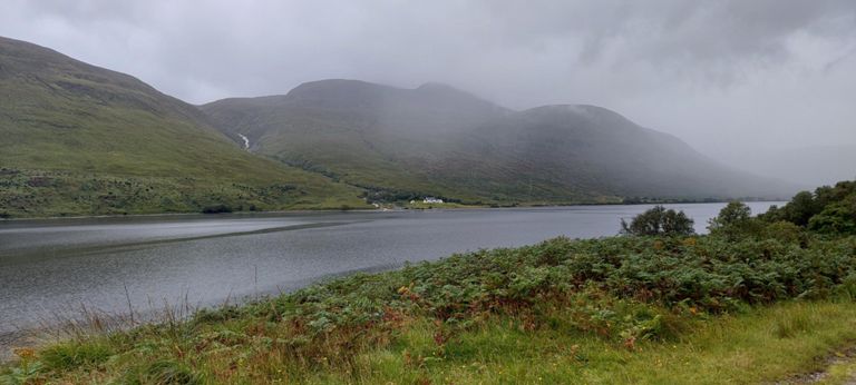House at Aultanrynie on the east side near the bottom of Loch More - I watched the white cloud lower and drifted across the loch. Rain started falling as I drew level with the hamlet and was soon engulfed in torrential rain climbing after the loch. The bus we had taken yesterday to Keoldale stopped and we had a brief chat.