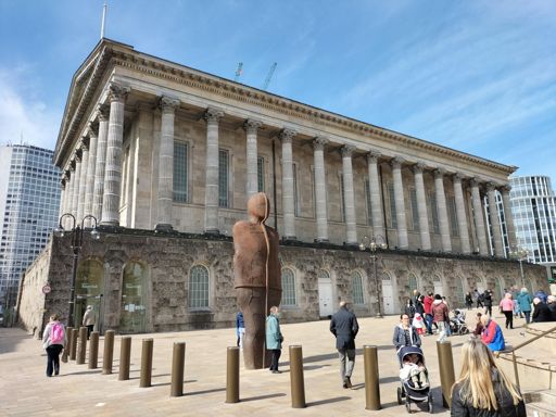 Antony Gormless. The impressive view is the building behind. If it was in the middle of the countryside it would look like ' the wicker Man !'
