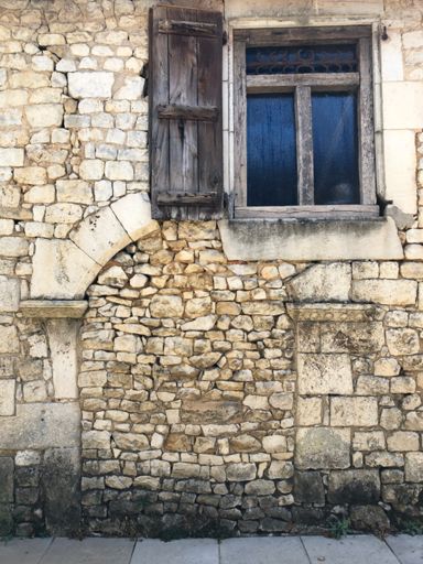 12th century doorway to a small monastery, now part of a garage