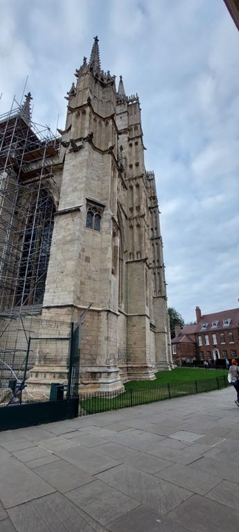 South east corner of York Minster – between Deangate (south) and College Street (east).   Cleaned my bike before going into York.   The Minster was closed to sight-seeing by the time I had walked counter-clockwise around the perimeter. I experienced evensong via the South Transept doors - much in Latin - with Geoff and Mary-Loo from Pittsburgh, Penn, then back to our Warmshowers hosts, unaware Lorraine had previously contacted them.  https://en.m.wikipedia.org/wiki/York_Minster & interactive tour: https://yorkminster.org/discover/interactive-map/