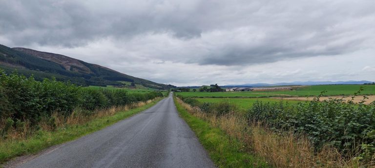 Looking behind us, with the Orchil Hills on our left.   Having been concerned about climbing high over the Scottish hills and mountains seen in photos, I realised today that roads follow valleys, by the flattest available route. That realisation calmed me further.  There were a few exceptions coming up, e.g. between Tongue and Durness where the road was feet from the top but they were rarities.