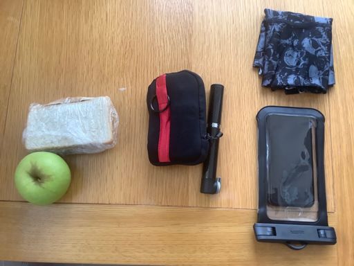 Preping for today’s ride; from the right - phone, credit card, ID and face cover.  Spares pack and pump.  Home made rhubarb jam butty and 1 of 5 a day!🤪🚴‍♂️