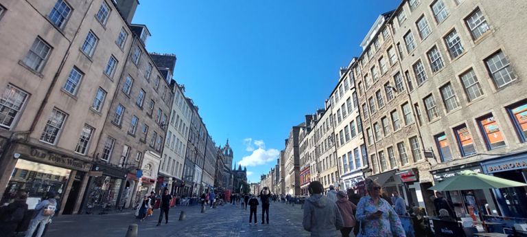 Looking south west up The Royal Mile - Lawnmarket, Castlehill - towards Edinburgh Castle, with St Giles Cathedral on the left
