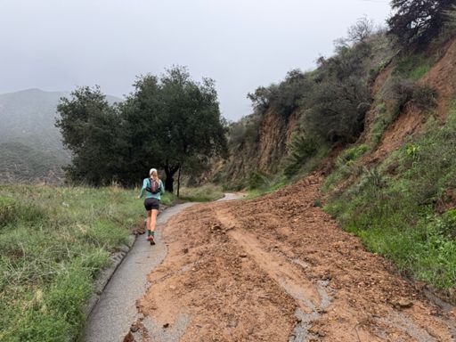 Kat leads the way going up Chaney Trail toward Sunset / Lowe Road.  One of the slides on the road.  Passable by foot but it's definitely going to take some work to clear these challenges along the way.