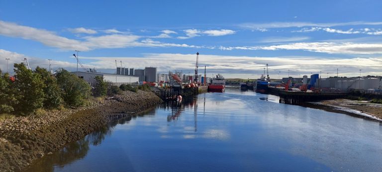 River Dee looking seawards with Mearns Quay then Point Law Oil Terminal on the left and Torry Quay on the right. https://www.portofaberdeen.co.uk/harbour-information/ & https://canmore.org.uk/site/104099/aberdeen-harbour-mearns-quay