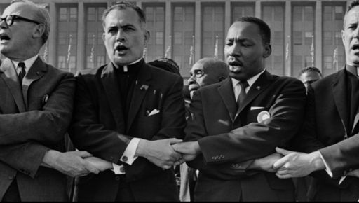 A common purpose. This photograph hangs in the Smithsonian Institution’s National Portrait Gallery. It shows Father Hesburgh, Notre Dame's president, together with Dr. Martin Luther King Jr. during a 1964 civil rights rally at Chicago’s Soldier Field. That same year Father Hesburgh was awarded the Medal of Freedom, the nation’s highest civilian honor, for his visionary work against elements of apartheid in America.