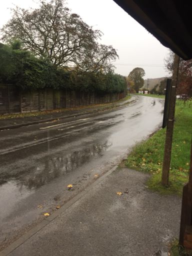 Waiting out the worst of the rain in a bus shelter near Hughenden Valley