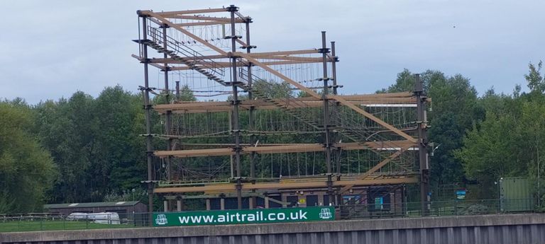 Airtrail was on the opposite bank from San Seb Coffee.
The website  for this rope adventure facility has descriptive photos of the location and bridges in the area.
https://www.teesactive.co.uk/air-trail-high-ropes/#air-trail